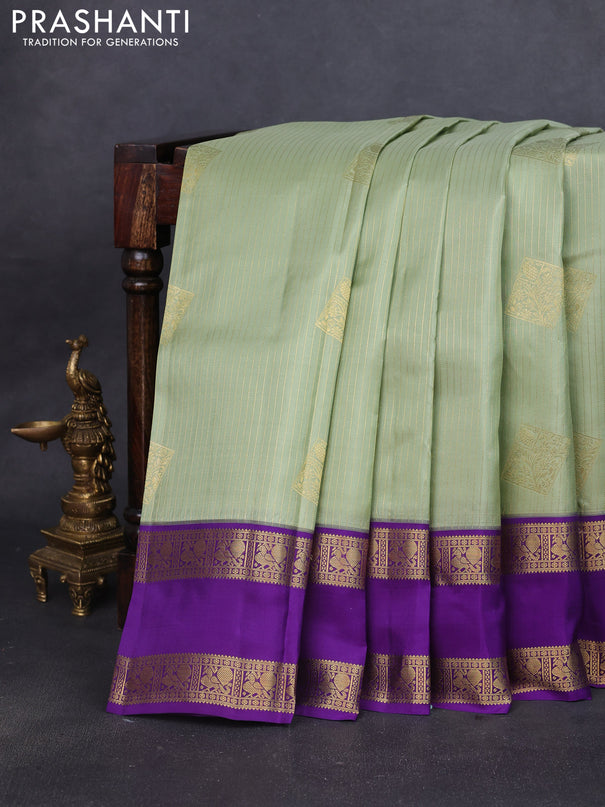 Pure kanchipuram silk saree pastel green and violet with allover zari weaves & buttas and rettapet zari woven korvai border