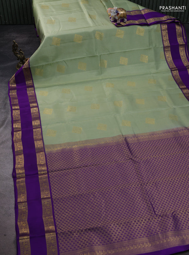 Pure kanchipuram silk saree pastel green and violet with allover zari weaves & buttas and rettapet zari woven korvai border
