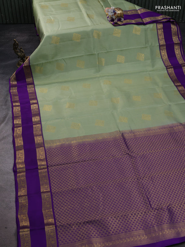 Pure kanchipuram silk saree pastel green and violet with allover zari weaves & buttas and rettapet zari woven korvai border