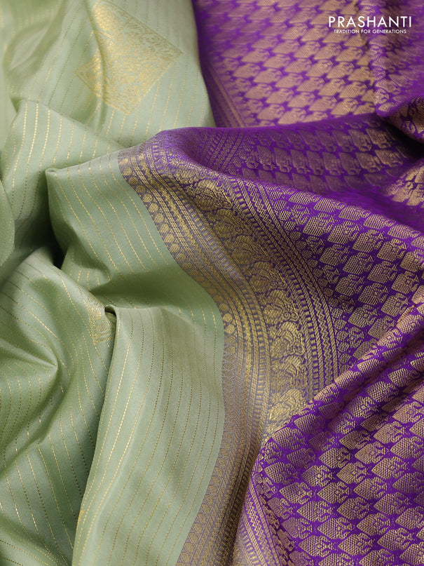 Pure kanchipuram silk saree pastel green and violet with allover zari weaves & buttas and rettapet zari woven korvai border