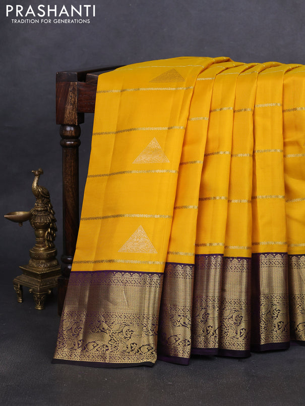Pure kanchipuram silk saree yellow and deep purple with allover zari weaves & buttas and rich zari woven korvai border
