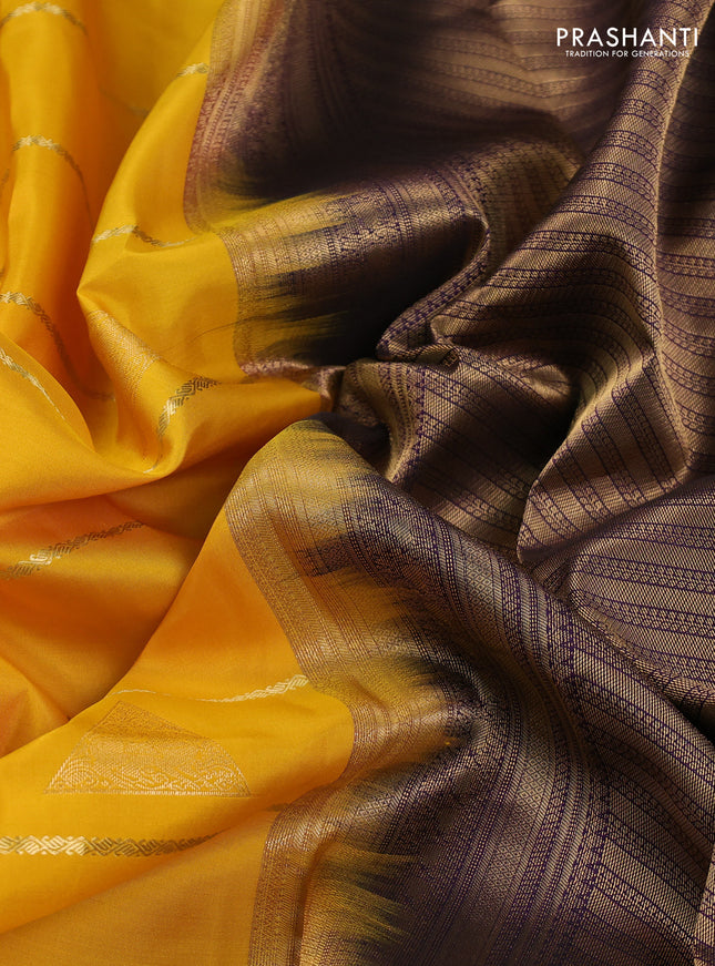 Pure kanchipuram silk saree yellow and deep purple with allover zari weaves & buttas and rich zari woven korvai border