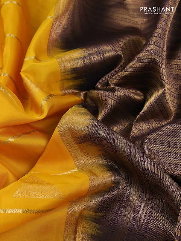 Pure kanchipuram silk saree yellow and deep purple with allover zari weaves & buttas and rich zari woven korvai border