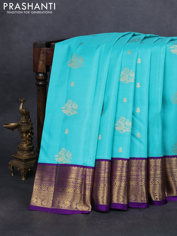 Pure kanchipuram silk saree teal blue and violet with zari woven buttas and zari woven korvai border