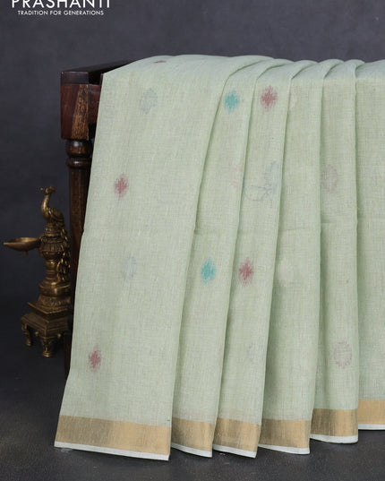 Linen cotton saree pista green with allover thread woven buttas and peacock pallu