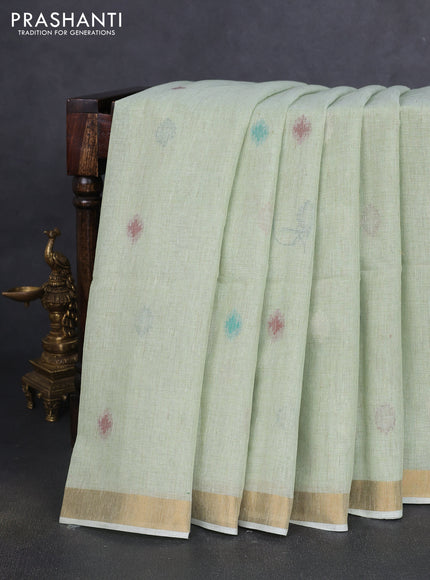 Linen cotton saree pista green with allover thread woven buttas and peacock pallu