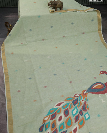 Linen cotton saree pista green with allover thread woven buttas and peacock pallu