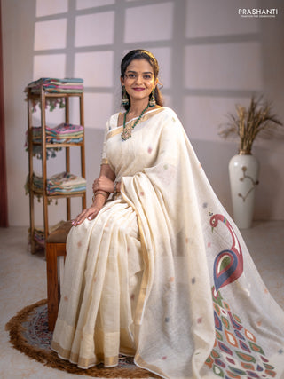 Linen cotton saree cream with allover thread woven buttas and peacock pallu
