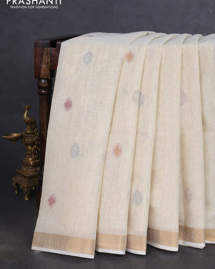 Linen cotton saree cream with allover thread woven buttas and peacock pallu