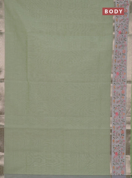 Kota saree pista green and off white with plain body and embroidery work border