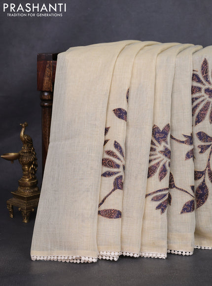 Semi linen tissue saree cream and jamun shade with kalamkari applique work and crocia lace work border