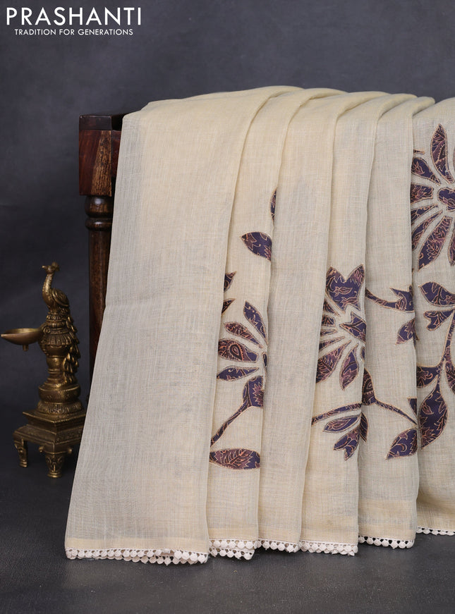 Semi linen tissue saree cream and jamun shade with kalamkari applique work and crocia lace work border