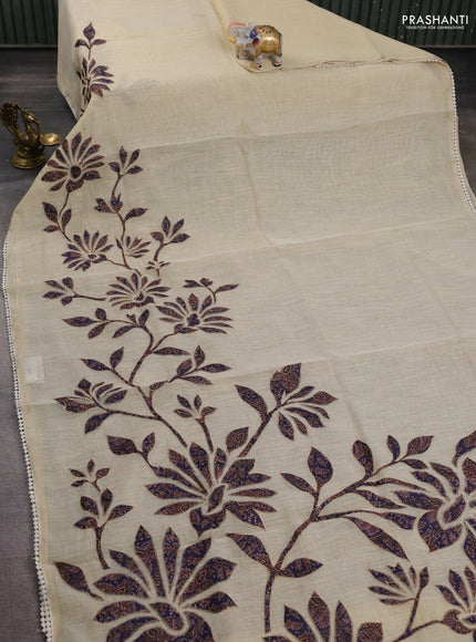 Semi linen tissue saree cream and jamun shade with kalamkari applique work and crocia lace work border