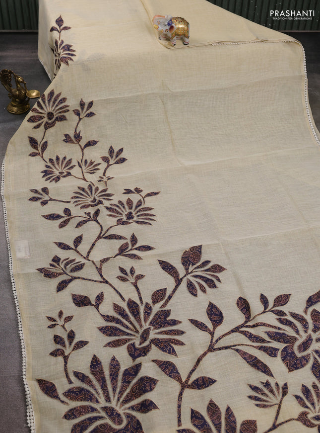 Semi linen tissue saree cream and jamun shade with kalamkari applique work and crocia lace work border