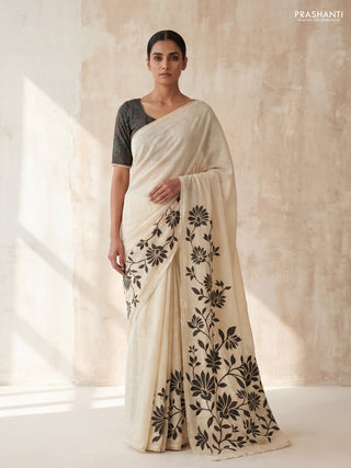 Semi linen tissue saree cream and green with kalamkari applique work and crocia lace work border