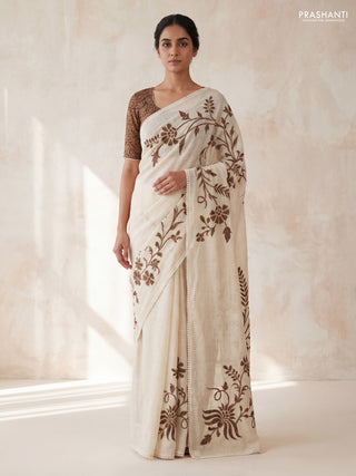 Semi linen tissue saree cream and brown with applique work and crocia lace work border