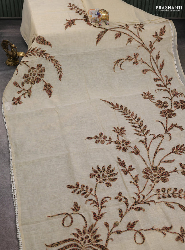 Semi linen tissue saree cream and brown with applique work and crocia lace work border