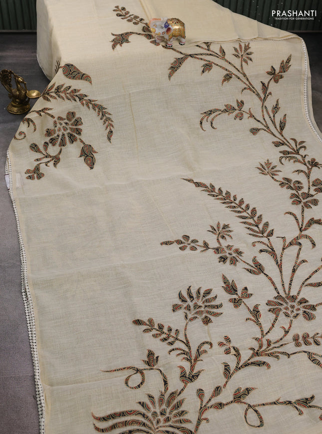 Semi linen tissue saree cream and black with applique work and crocia lace work border