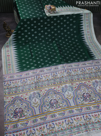 Pochampally silk saree bottle green and cream with allover ikat woven buttas and madhubani prints