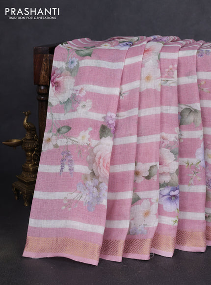 Pure linen silk saree mild peach with allover floral prints and zari woven border