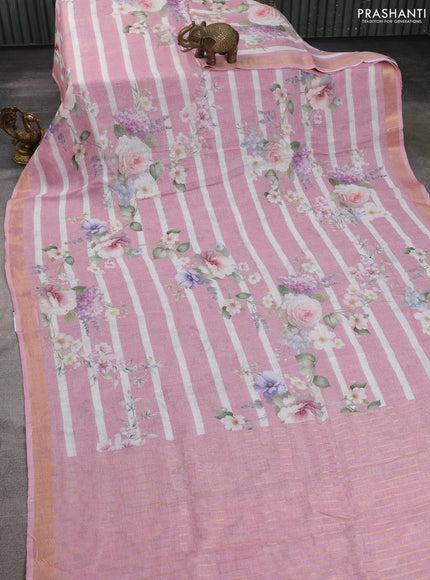 Pure linen silk saree mild peach with allover floral prints and zari woven border