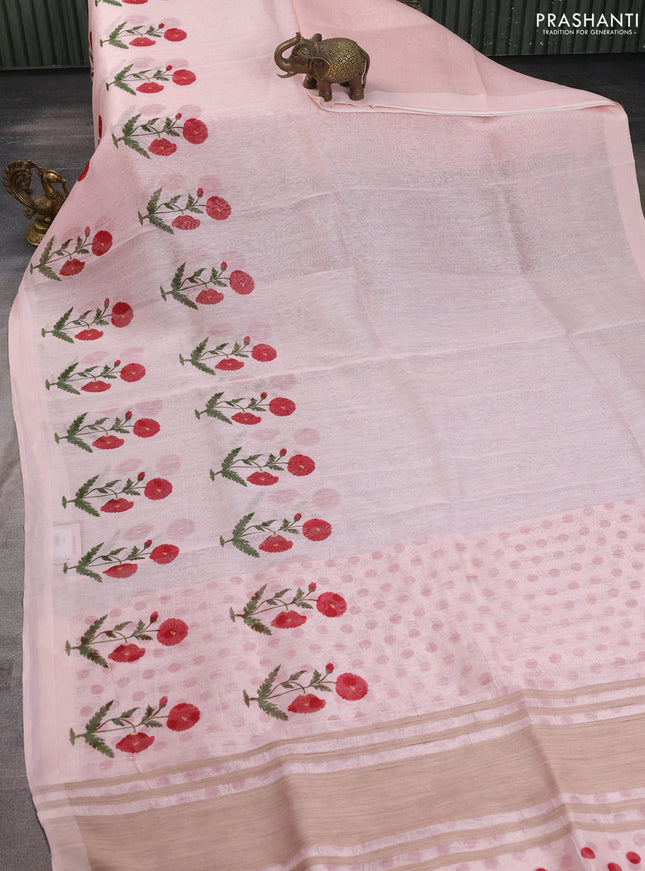 Pure linen silk saree mild peach with allover floral prints and simple border
