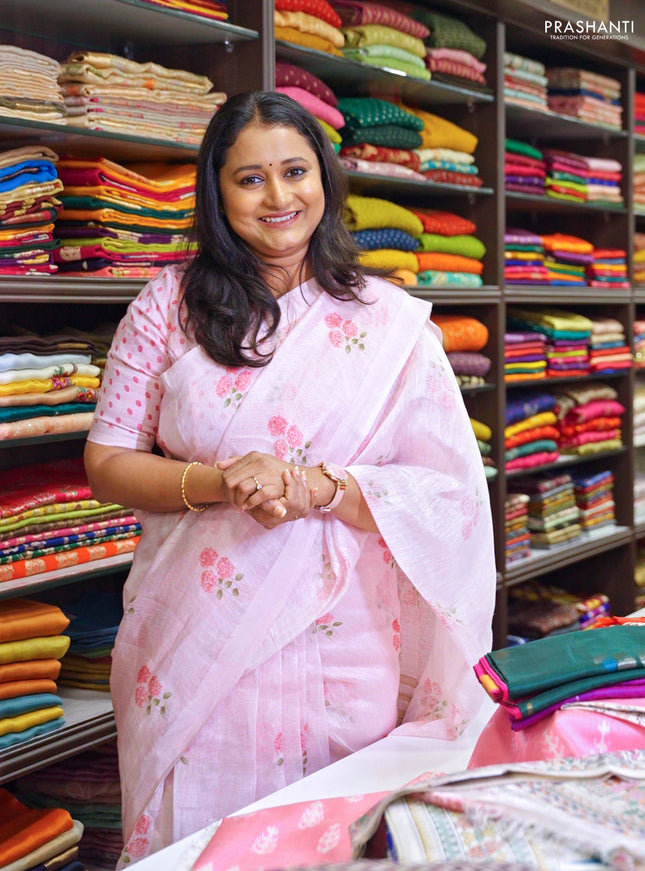 Pure linen silk saree light pink with allover floral prints and simple border