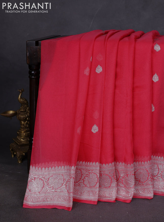 Banarasi chiffon saree peach pink shade with silver zari woven buttas and floral silver zari woven border
