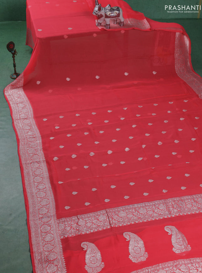 Banarasi chiffon saree peach pink shade with silver zari woven buttas and floral silver zari woven border