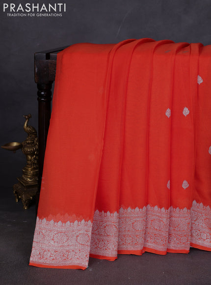 Banarasi chiffon saree orange with silver zari woven buttas and floral silver zari woven border