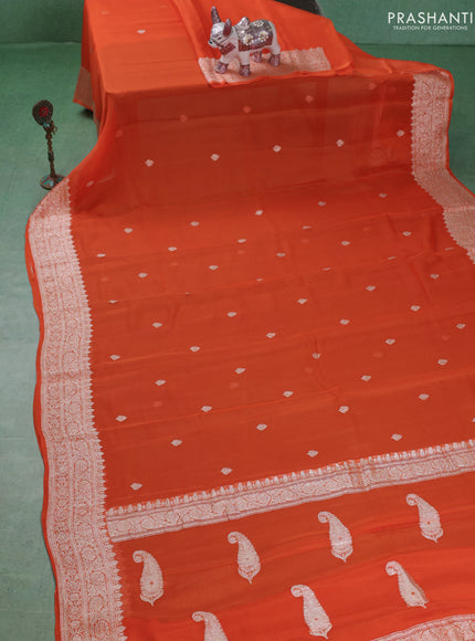 Banarasi chiffon saree orange with silver zari woven buttas and floral silver zari woven border