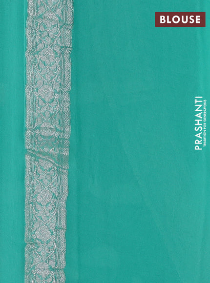 Banarasi chiffon saree teal green shade with silver zari woven buttas and floral silver zari woven border
