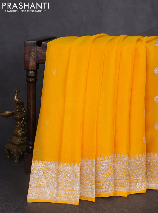 Banarasi chiffon saree yellow with silver zari woven buttas and floral silver zari woven border
