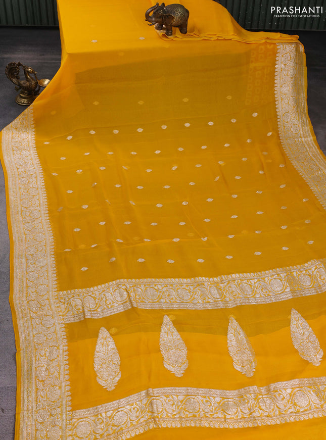 Banarasi chiffon saree yellow with silver zari woven buttas and floral silver zari woven border