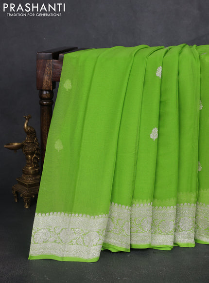 Banarasi chiffon saree light green with silver zari woven buttas and floral silver zari woven border