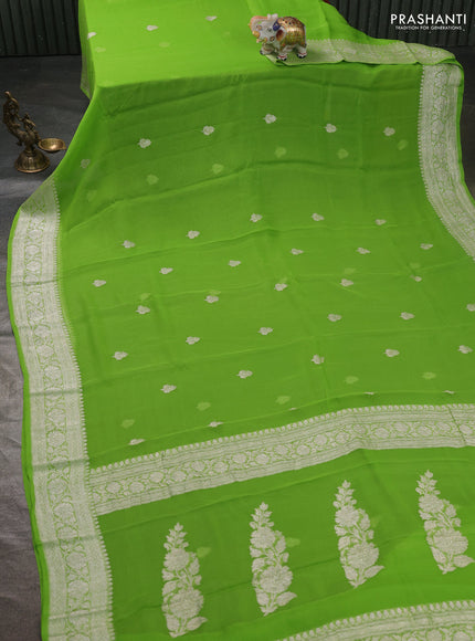 Banarasi chiffon saree light green with silver zari woven buttas and floral silver zari woven border