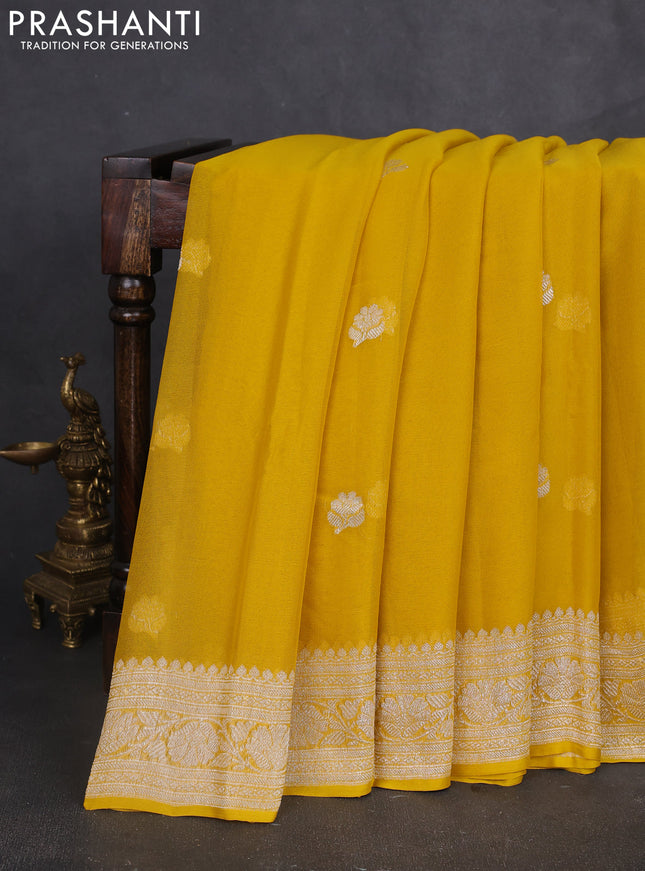 Banarasi chiffon saree yellow with silver zari woven buttas and floral silver zari woven border