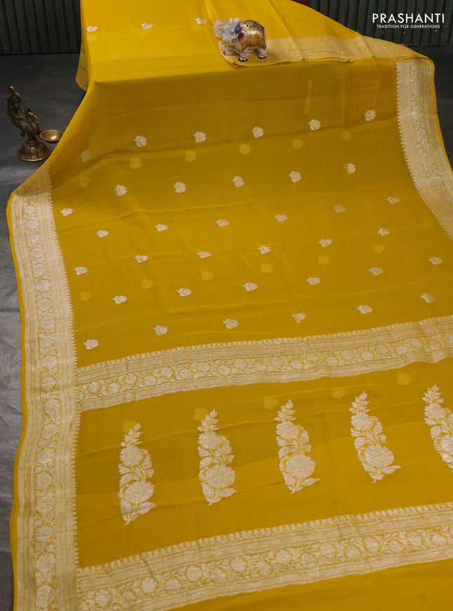 Banarasi chiffon saree yellow with silver zari woven buttas and floral silver zari woven border