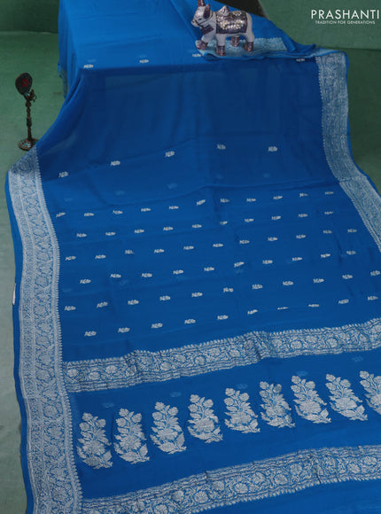 Banarasi chiffon saree cs blue with silver zari woven buttas and floral silver zari woven border