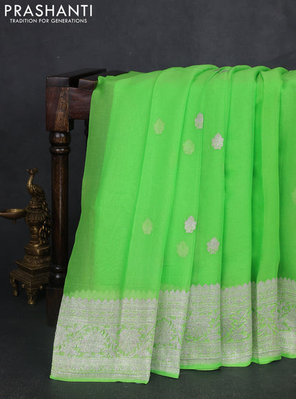 Banarasi chiffon saree fluorescent green with silver zari woven buttas and floral silver zari woven border