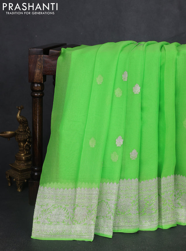 Banarasi chiffon saree fluorescent green with silver zari woven buttas and floral silver zari woven border
