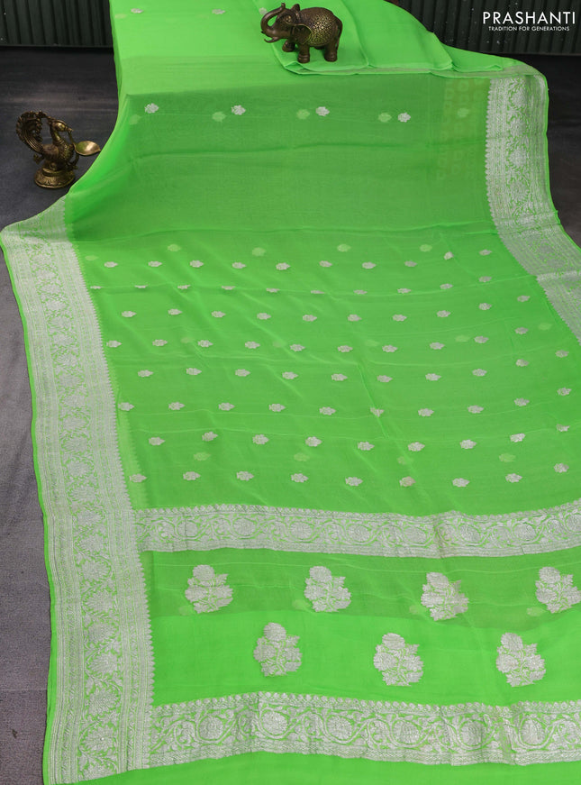 Banarasi chiffon saree fluorescent green with silver zari woven buttas and floral silver zari woven border