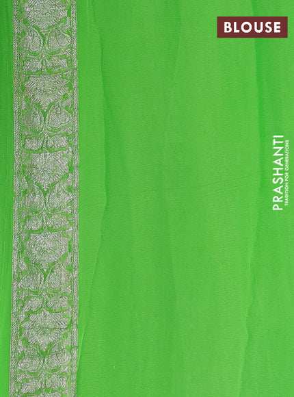Banarasi chiffon saree fluorescent green with silver zari woven buttas and floral silver zari woven border