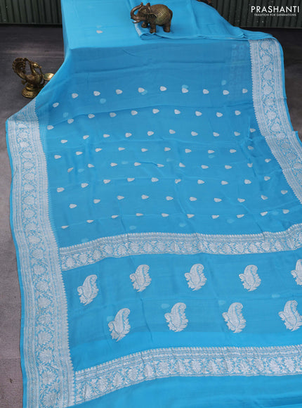 Banarasi chiffon saree light blue with silver zari woven buttas and floral silver zari woven border