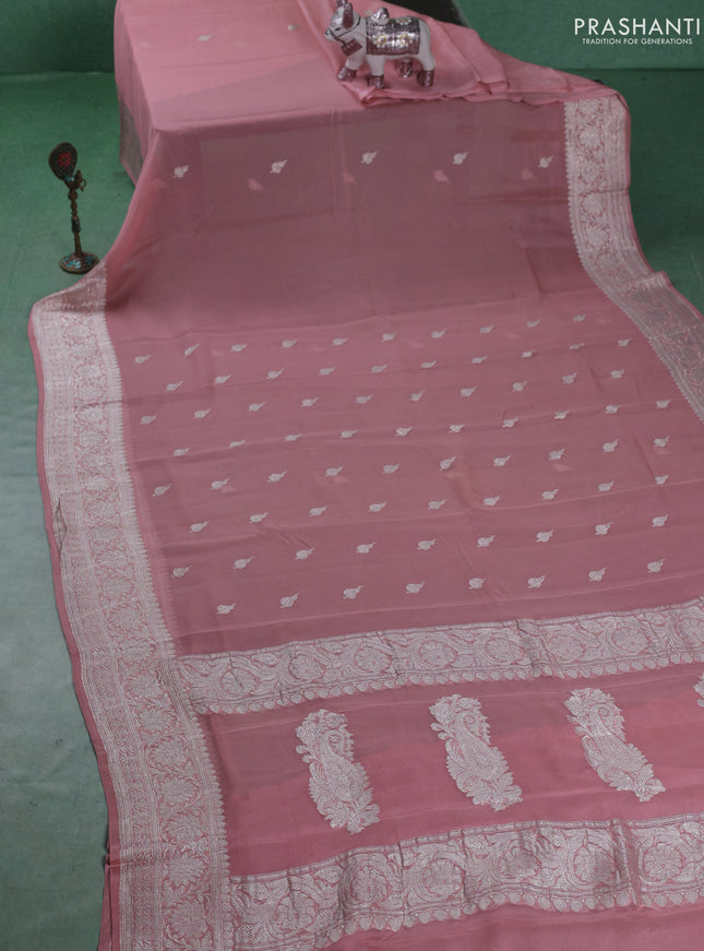 Banarasi chiffon saree pastel peach with silver zari woven buttas and floral silver zari woven border