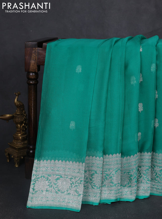 Banarasi chiffon saree teal green with silver zari woven buttas and floral silver zari woven border