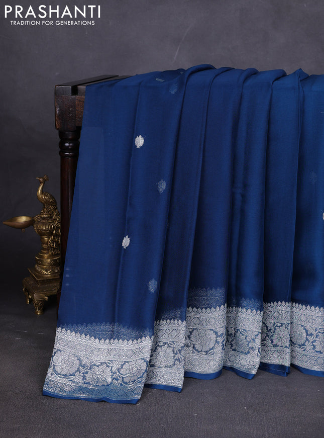 Banarasi chiffon saree peacock blue with silver zari woven buttas and floral silver zari woven border