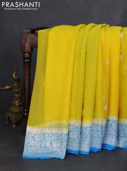 Banarasi chiffon saree yellow and cs blue with silver zari woven buttas and floral silver zari woven border