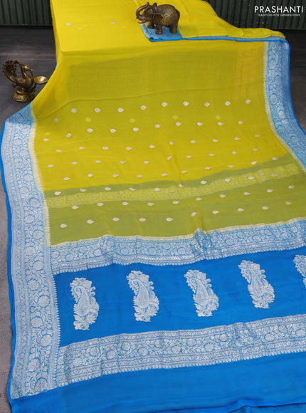 Banarasi chiffon saree yellow and cs blue with silver zari woven buttas and floral silver zari woven border