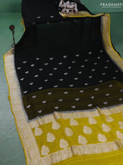 Banarasi chiffon saree black and yellow with silver zari woven buttas and floral silver zari woven border